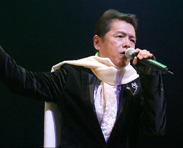 成田賢